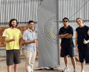 International buyer inspecting custom solid teak doors at an Indonesian door factory
